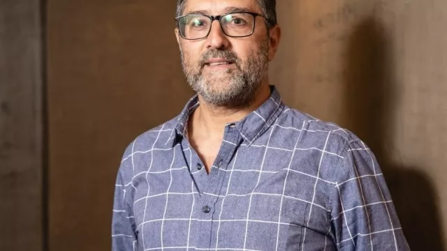 Con Carlos Dide, gerente general de Evertec 