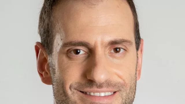 Con el director de la consultora Opción, Alan Cohn